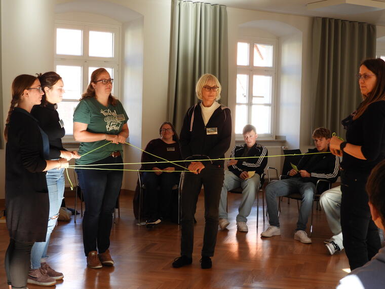 Teilnehmer/innen in einem Workshop